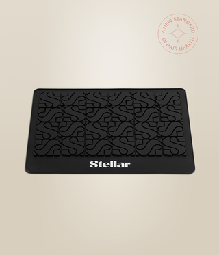 Front view of the black Stellar heat mat with its raised patterned surface.